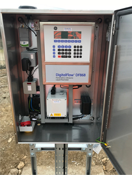 The inside of a kiosk with DF868 flowmeter transmitter and IoT telemetry logger installed